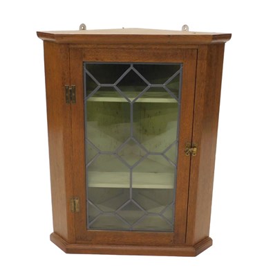 Lot 1134 - A 20thC oak hanging corner cupboard, of small...