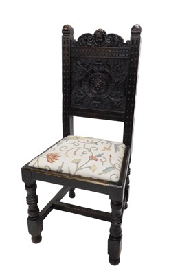 Lot 1117 - A 19thC oak side chair, the tall back carved...
