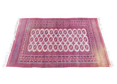 Lot 1171 - An Afghan Turkman style woollen rug, of...