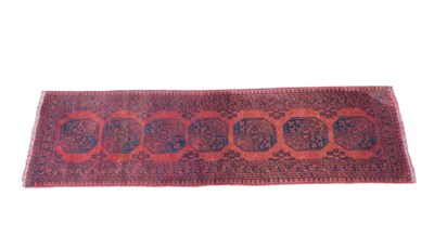 Lot 1174 - An Afghan tribal Bukhara style runner, of...
