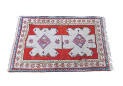 Lot 1176 - A 20thC woollen rug, of rectangular form, the...