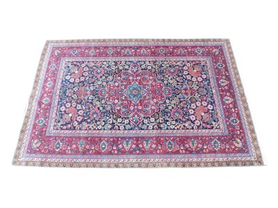 Lot 1171a - A Persian Kashan style rug, the outer fild in...